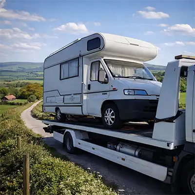 Large motorhome being recovered on a sussex road by specialist flatbed